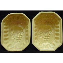 TWO OCTAGONALLY SHAPED DEEP SIDED GLAZED STONEWARE "GRAPE" MOLDS