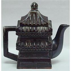 AN ENGLISH DARK BROWN GLAZED REDWARE TEAPOT