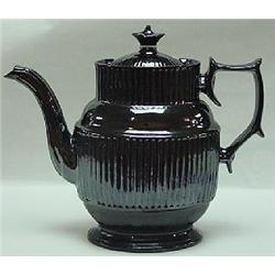 A BROWN GLAZED REDWARE COFFEE POT