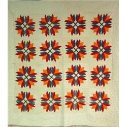 A HAND SEWN APPLIQUÉD QUILT