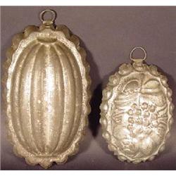 TWO OVAL TIN MOLDS