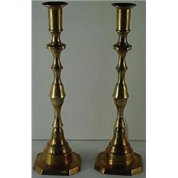 A PAIR OF TALL ENGLISH BRASS CANDLESTICKS