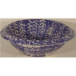 A BLUE SPONGE SPATTERWARE ROUND WASH BASIN