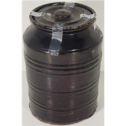 A BLACK GLAZED REDWARE COVERED STORAGE JAR
