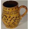 Image 1 : A PENNSYLVANIA DUTCH REDWARE PRESENTATION DRINKING MUG