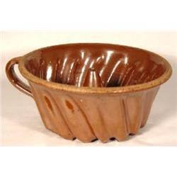 A REDWARE "TURK'S" HEAD MOLD