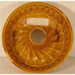 YELLOW PUMPKIN GLAZED STONEWARE "TURK'S HEAD" RING MOLD