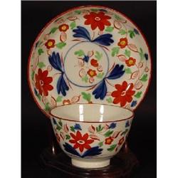 GAUDY PEARLWARE HANDLE-LESS TEA CUP AND MATCHING SAUCER