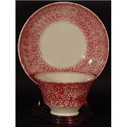 RED SPONGE SPATTERWARE PORCELAIN HANDLE-LESS TEA CUP AND MATCHING SAUCER