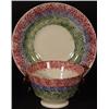 Image 1 : RAINBOW SPATTERWARE HANDLE-LESS TEA CUP AND MATCHING SAUCER