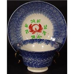 BLUE SPATTERWARE HANDLE-LESS TEA CUP AND MATCHING SAUCER