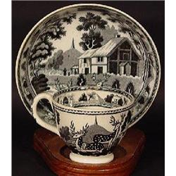 BLACK TRANSFER PORCELAIN TEA CUP AND SAUCER