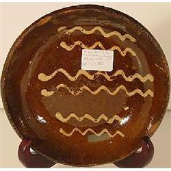 A PENNSYLVANIA REDWARE ROUND BOWL