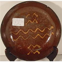 A PENNSYLVANIA REDWARE ROUND BOWL