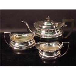 A THREE PIECE ELECTOPLATED NICKEL SILVER TEA SET