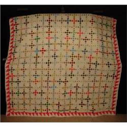 A HAND SEWN PATCHWORK QUILT