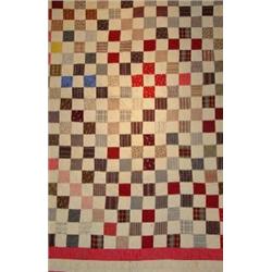 A HAND SEWN PATCHWORK QUILT