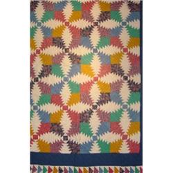 A HAND SEWN PATCHWORK QUILT