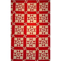 A HAND SEWN PATCHWORK QUILT