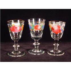 THREE STIEGEL-TYPE CLEAR  BLOWN AND FLORAL (POLYCHROME) ENAMELED WINE GLASSES