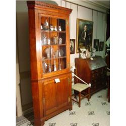 A VIRGINIA WALNUT TWO PART CORNER CABINET