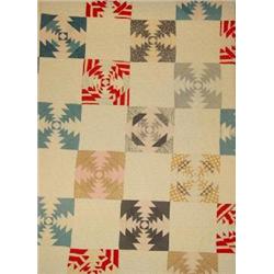 A HAND SEWN PATCHWORK QUILT
