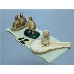 3 small carvings: bear, man, 2 people on a sled (2)