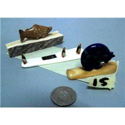 Carved bone salmon, blue-stone bear, 3 carved puffins (2)