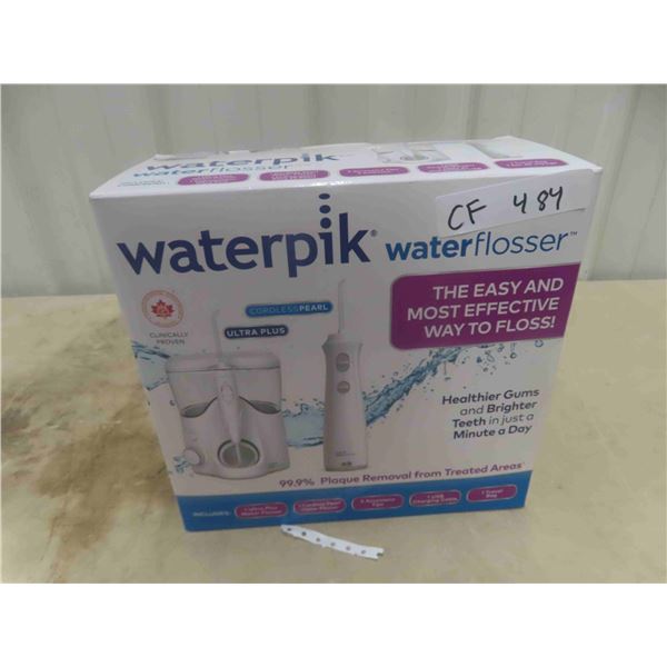 New Water Pik Water Flosser Cordless with 5 Attachments