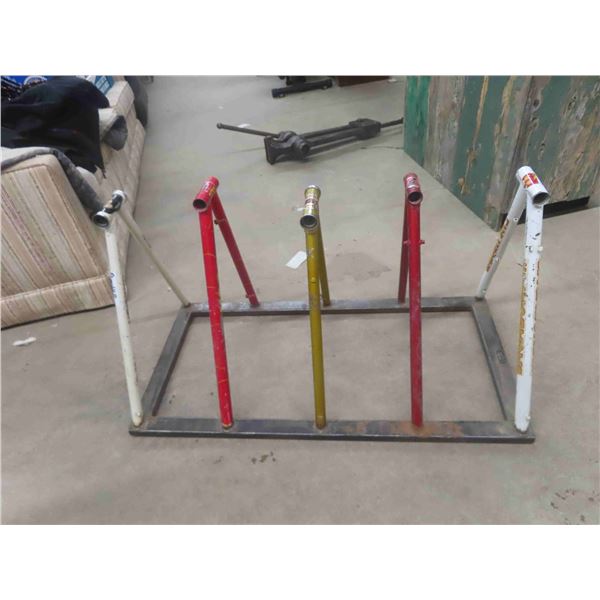 Bike Rack Made From Bicycles that Were Left Laying in the Driveway