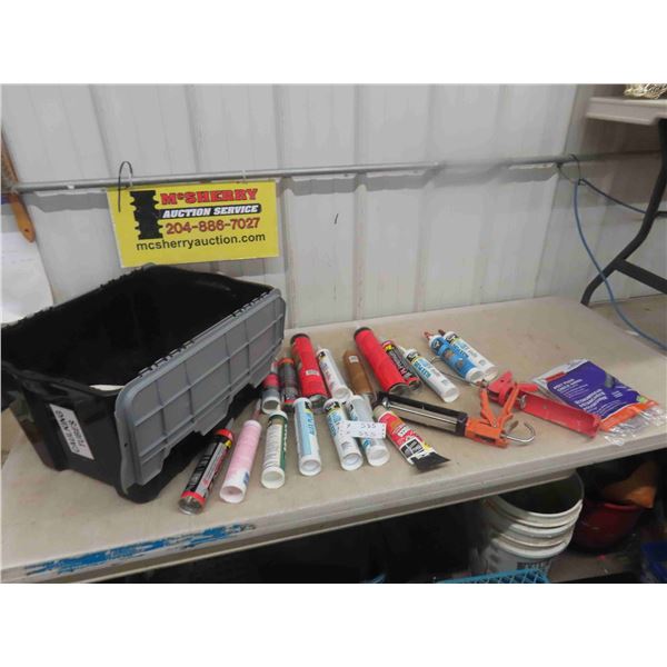 Storage Tub Full of Caulking Tubes + Caulking Guns