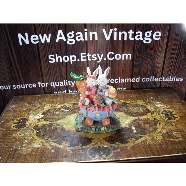 TWO RABBITS IN EGG CART