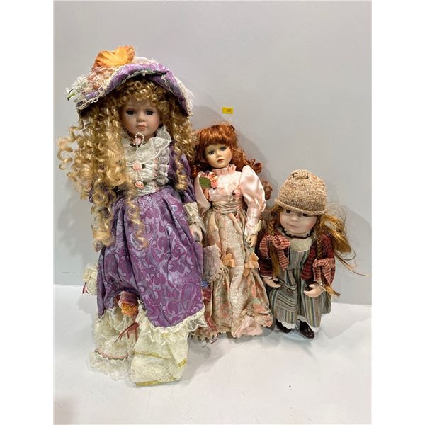 Collection of Three Porcelain Dolls 25H 18H and 14H