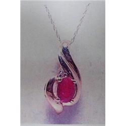Ruby and Diamond Pendant and Chain 10 K yellow gold- ruby is oval, faceted approx. 0.50 carats, tran