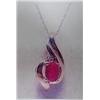 Image 1 : Ruby and Diamond Pendant and Chain 10 K yellow gold- ruby is oval, faceted approx. 0.50 carats, tran