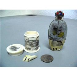 Lot of 2: 1 reverse glass snuff bottle; 1 cylindrical ivory box scrimshawed with cabin scene (2)