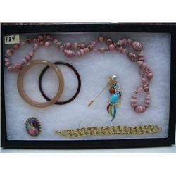Display box of costume jewelry (74)
