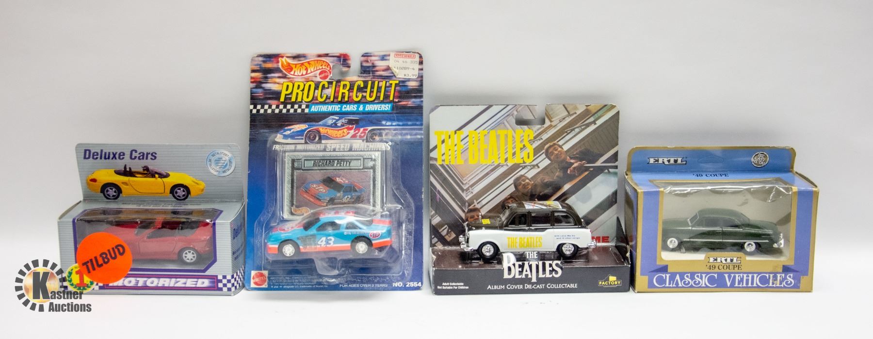 4 ASSORTED DIECAST CARS INCLUDES ERTL, DELUXE CARS