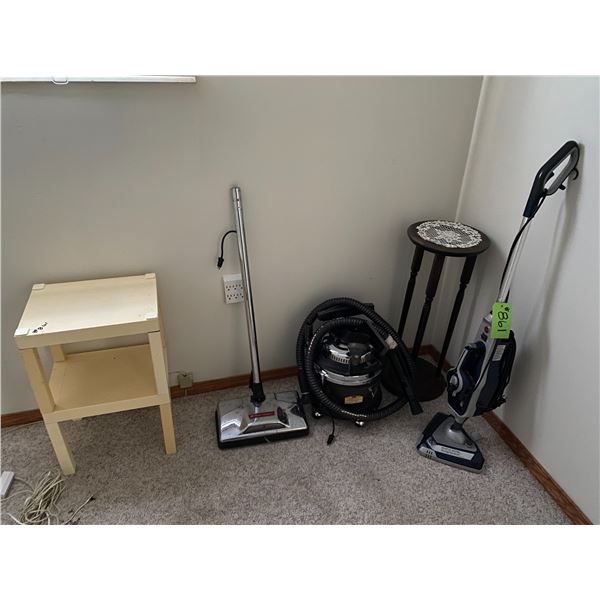2- Table stands, Hoover steam Scrubber (missing cloth attachments) and a Filter Queen vacuum (appear