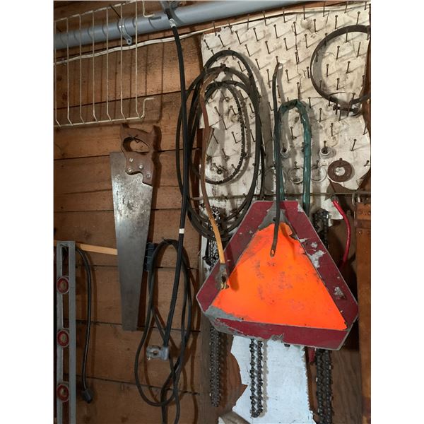 Misc. on the wall, slowing moving sign, chain, saw, level, etc.