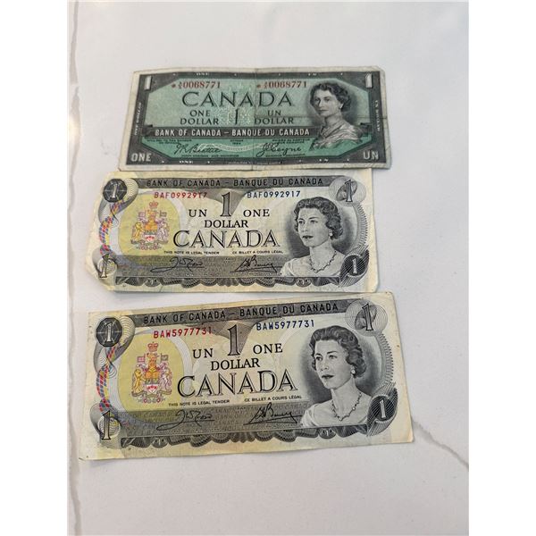 3 Canada $1 bills