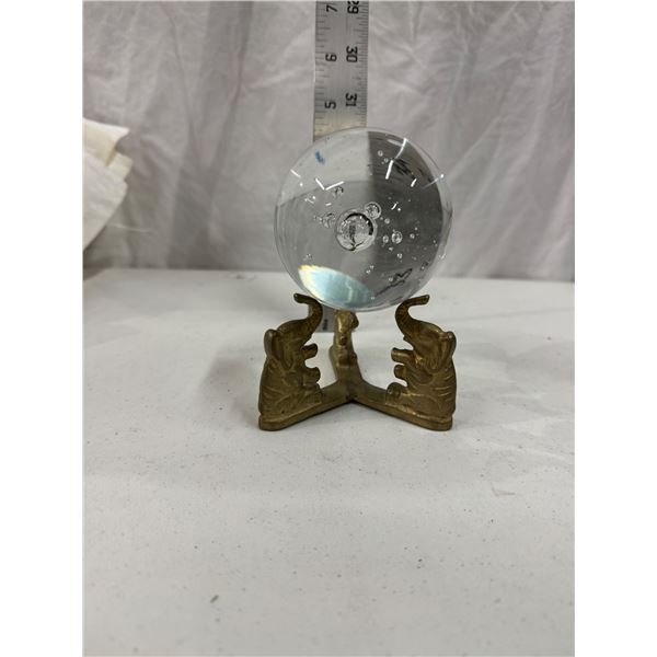 Elephant stand and glass ball