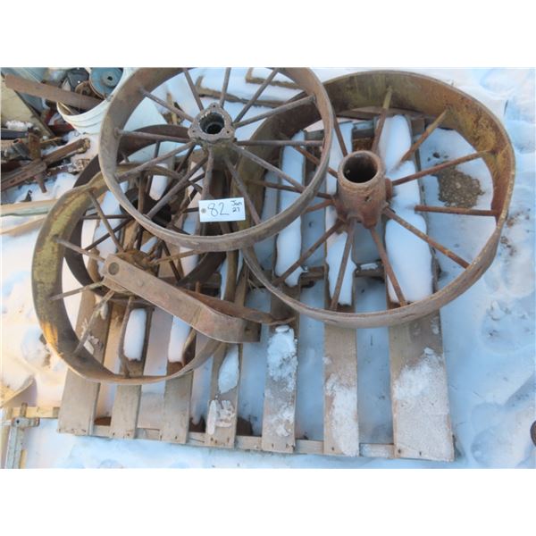 four vintage steel wagon wheels