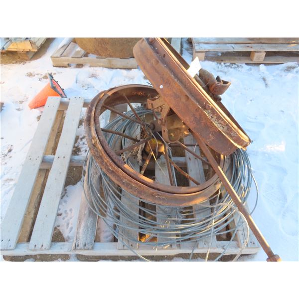 two steel vintage wagon wheels and roll of steel cable