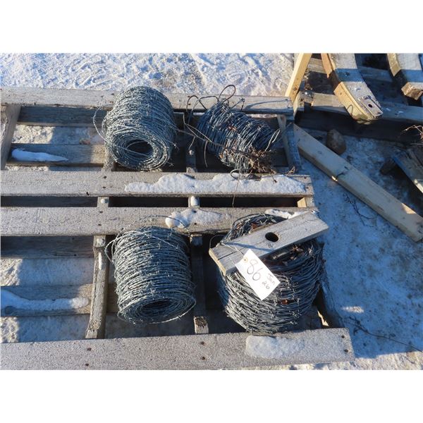 four partial rolls of barbed wire one may be full