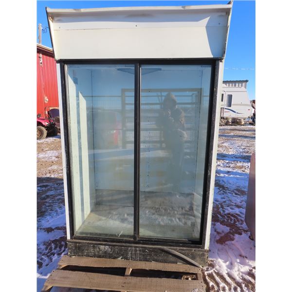 restaurant cooler for pop , prepped veggies and misc . Coca cola decals sliding doors