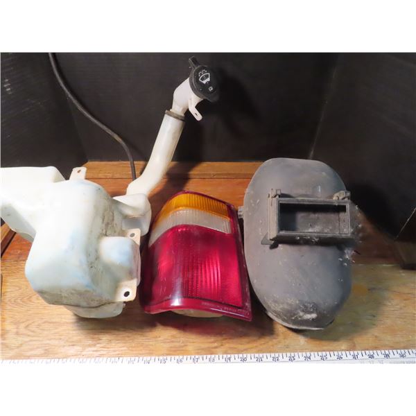 washer fluid resovoir , tail light , welding helmet