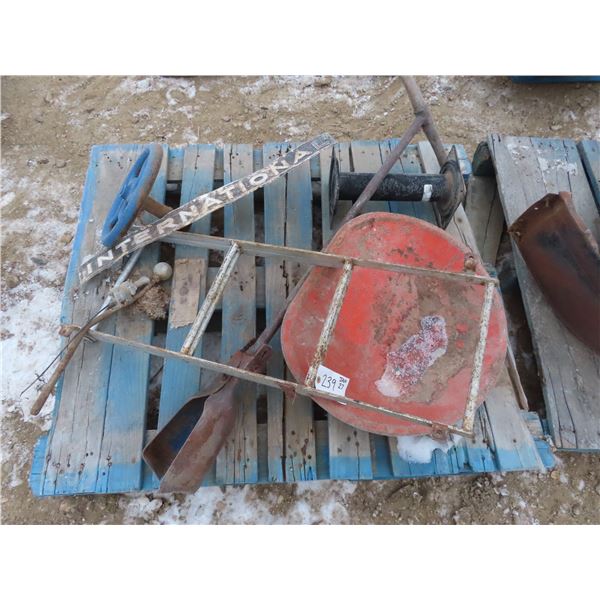 tractor seat , internaional badge , post hole digger