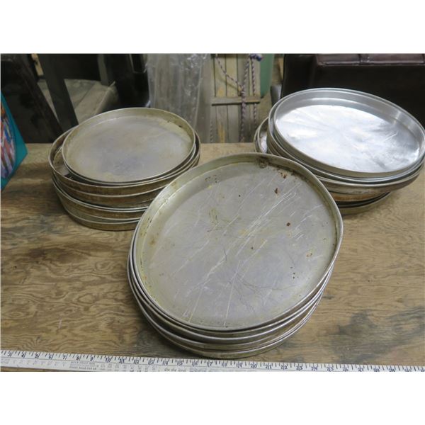 large lot of pizza pans