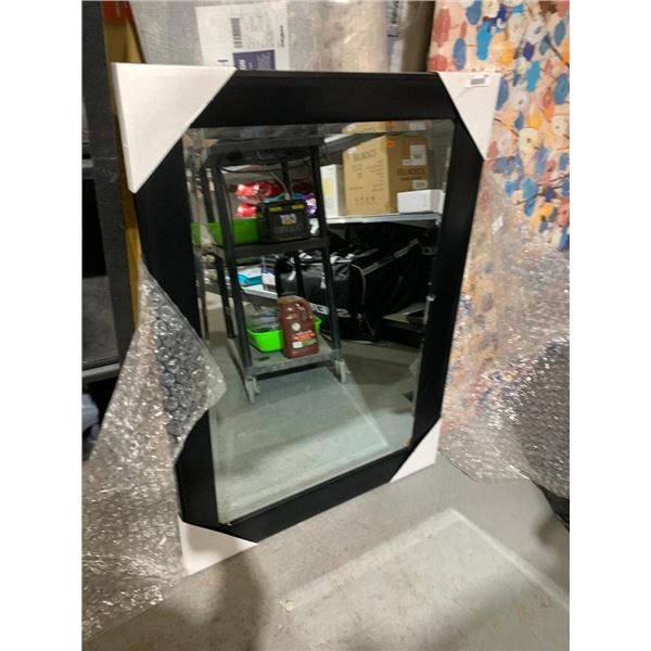 Hanging mirror with black frame